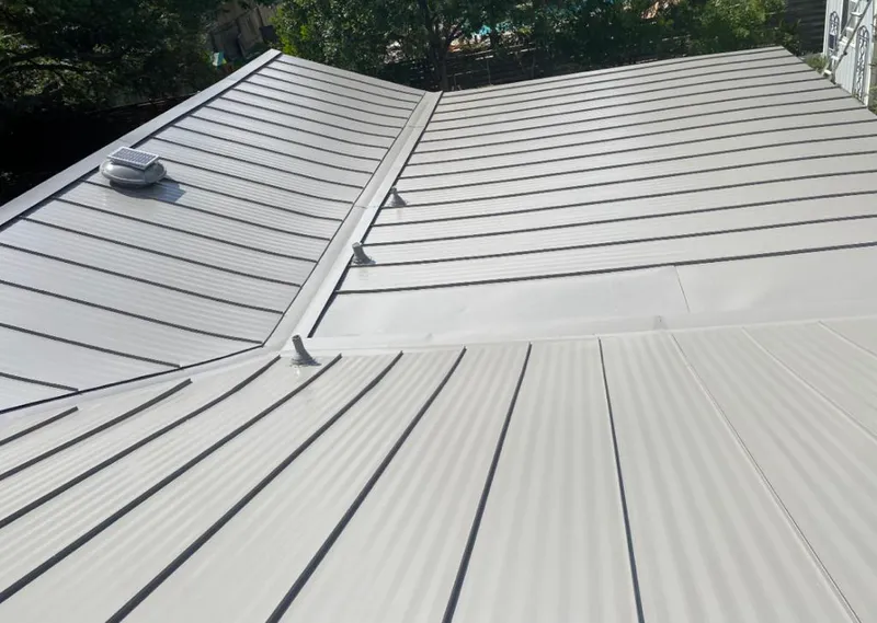 Solar attic fan installed on a metal roof for Roof Ventilation in St. Simons